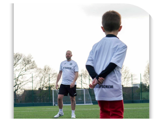 Young footballer posing with GS Coaching Academy Football Kit