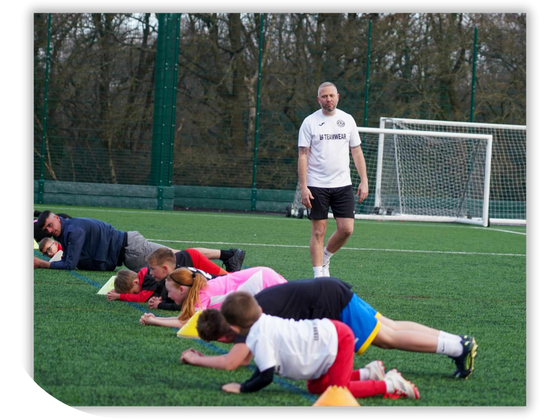 Larger group of yound footballers at coaching session at GS Coaching Academy
